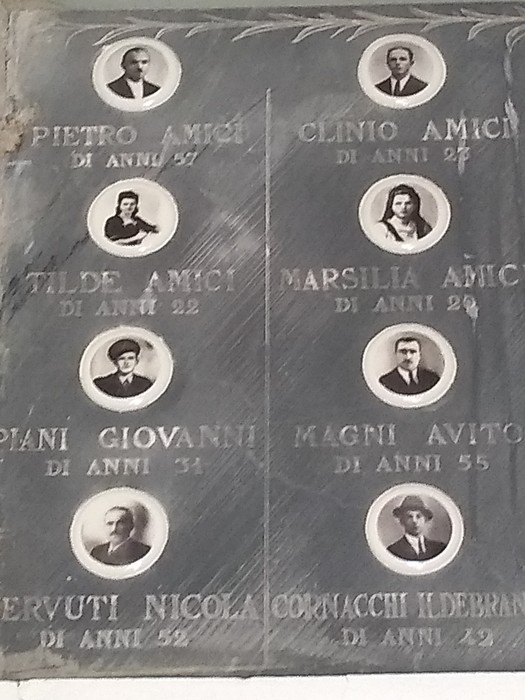 Sacrario delle vittime dell'eccidio di Villa Martuzzi, con ritratti e nomi commemorativi.
