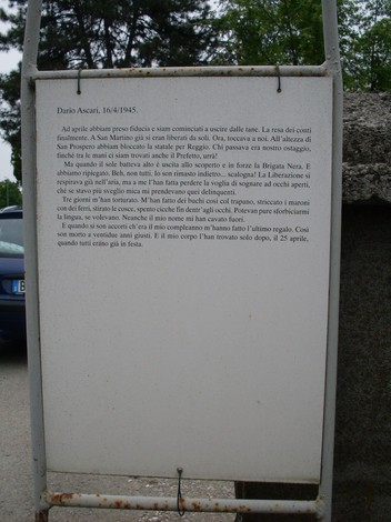 Cippo commemorativo dedicato a Dario Ascari, che ricorda la sua vita e il sacrificio durante la guerra.