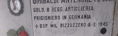 Lapidi commemorative dedicate ai caduti per la Libertà, con omaggi floreali.