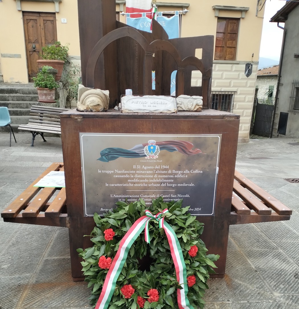 Monumento in memoria della distruzione di Borgo alla Collina, commemorando eventi storici del 1944.