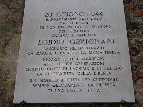 Muro commemorativo ai caduti di San Donato, in memoria dei patrioti e del loro sacrificio per la libertà.